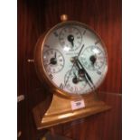 AN UNUSUAL LARGE BRASS COMPASS / CLOCK