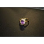 A HALLMARKED 18CT GOLD AMETHYST AND DIAMOND DRESS RING, APPROX 3.6 G, RING SIZE O ;