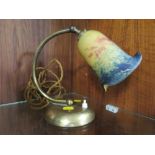 A VINTAGE BRASS DESK LAMP WITH COLOURED GLASS SHADE
