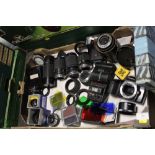 A TRAY OF ASSORTED CAMERA ACCESSORIES TO INCLUDE LENSES