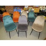 A MODERN HARLEQUIN SET OF SEVEN UPHOLSTERED DINING CHAIRS