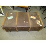 A LARGE VINTAGE BANDED PACKING TRUNK WITH VARIOUS STICKERS TO INCLUDE A NORTHERN STAR EXAMPLE