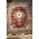 A 20TH CENTURY EASTERN RUG WITH FLORAL CENTRAL CARTOUCHE 231 X 156 CM