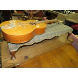 AN ANTIQUE LONG UPHOLSTERED STOOL AND AN ACOUSTIC GUITAR (2)