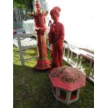 A RED PAINTED ORIENTAL PAGODA STAND WITH A DAMAGED GEISHA STATUE AND PAGODA STAND