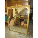 AN ANTIQUE GILT OVERMANTEL MIRROR WITH CARVED DETAIL H-140 W-1216 CM