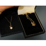A YELLOW METAL HEART SHAPED LOCKET ON 9CT GOLD CHAIN TOGETHER WITH A GILT SILVER PENDANT NECKLACE (
