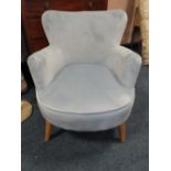 A MODERN UPHOLSTERED ARMCHAIR