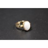 A HALLMARKED 9CT GOLD OPAL SET DRESS RING, opal within a rub over mount approx W 10 cm, H 12 mm,