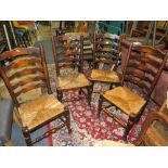 A SET OF FOUR OAK WICKERSEAT DINING CHAIRS