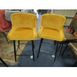 A PAIR OF MODERN MUSTARD UPHOLSTERED KITCHEN STOOLS