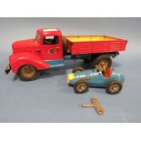 AN ELECTRIC TINPLATE GAMA TRUCK TOGETHER WITH A TIN PLATE SCHUCO GRAND PRIX RACER WITH KEY