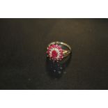A HALLMARKED 9CT GOLD RUBY AND DIAMOND CLUSTER RING, APPROX 3.9 G, RING SIZE K-L