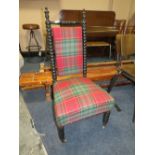 AN ANTIQUE EBONISED BOBBIN TURNED BEDROOM CHAIR WITH MODERN UPHOLSTERY