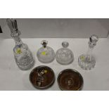 A PAIR OF SILVER PLATED BOTTLE COASTERS TOGETHER WITH A SELECTION OF CUT GLASS DECANTERS ETC