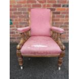A 19TH CENTURY MAHOGANY FRAMED OPEN GENTLEMANS ARMCHAIR, with carved detail, with original ceramic