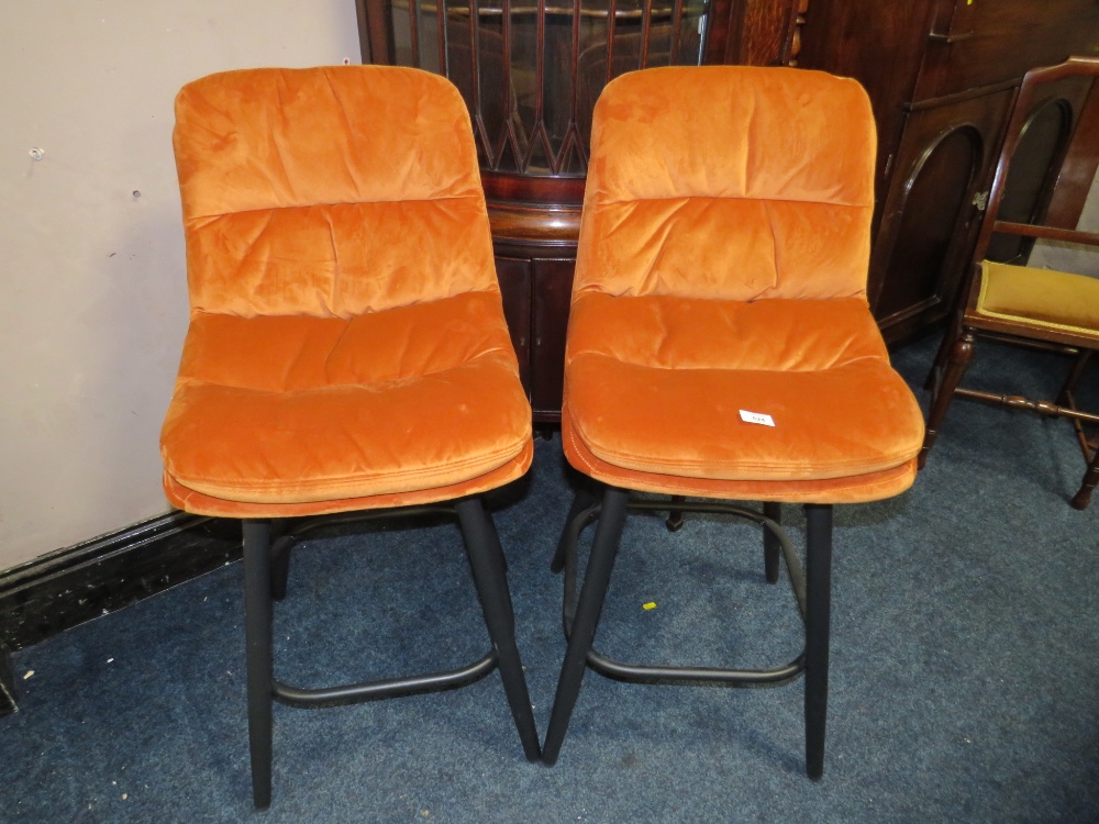 A PAIR OF MODERN BURNT ORANGE KITCHEN STOOLS