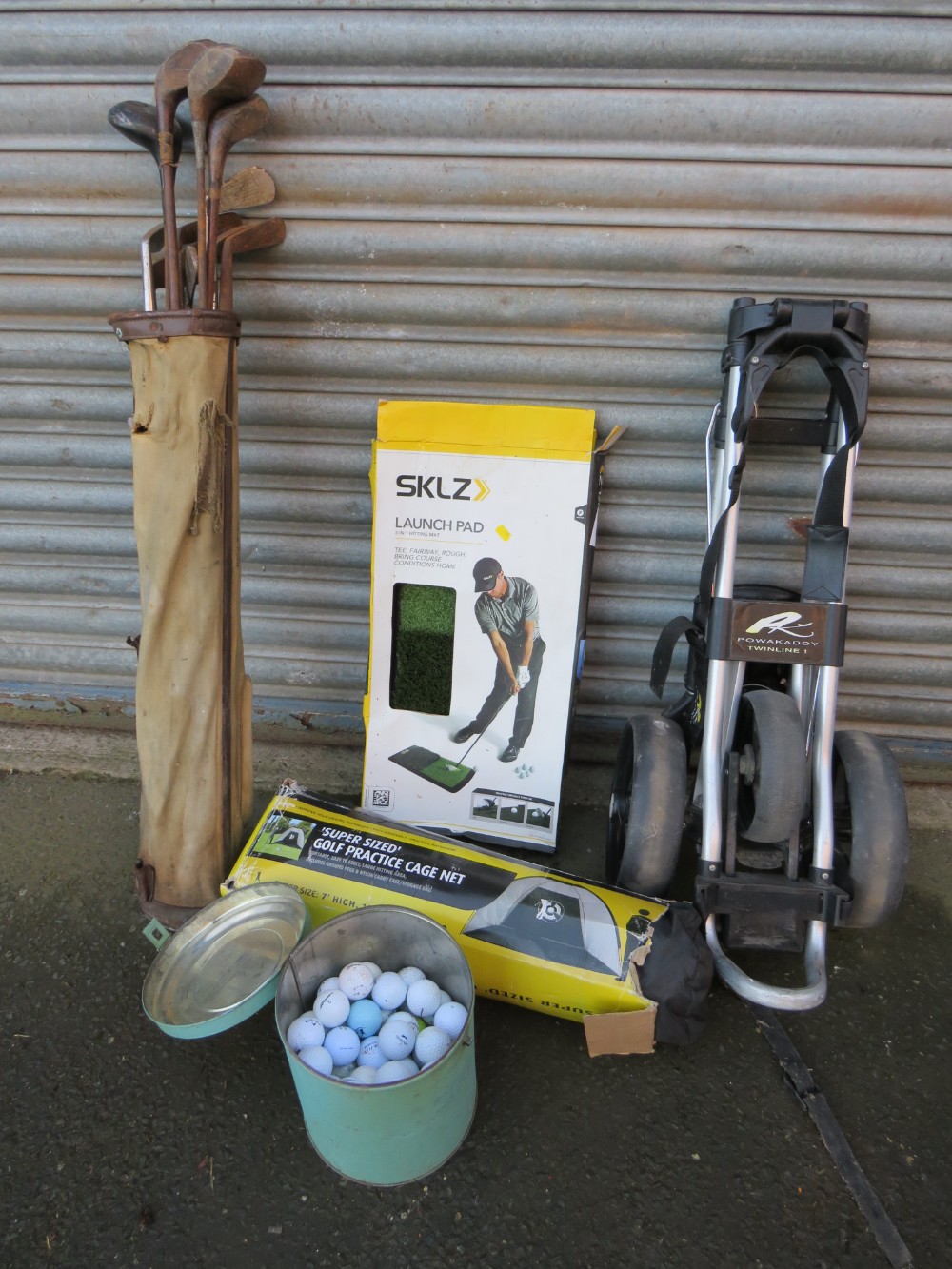 A SET OF VINTAGE GOLF CLUBS, POWAKADDY TWINLINE 1 GOLF TROLLEY, CATCH NET, MAT AND BALLS