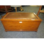 AN OAK BOX WITH UPHOLSTERED TOP - W 64 CM