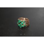 A CONTINENTAL FIVE BAND MULTI SECTION RING SET WITH EMERALDS, STAMPED 14A, APPROX 6.3 G, RINGS