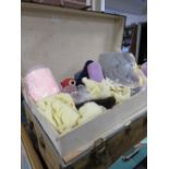 A LARGE PACKING TRUNK AND CONTENTS COMPRISING TEXTILES, FABRIC PANELS. WOOL ETC