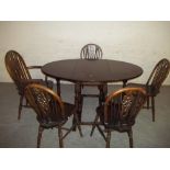 AN OAK REPRODUCTION DINING SET