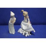 TWO LLADRO FIGURINES INCLUDING A GIRL HOLDING A TELEPHONE WITH A PUPPY