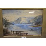 A FRAMED AND GLAZED WATERCOLOUR OF A LAKESIDE SCENE