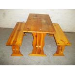 A SOLID PINE KITCHEN TABLE AND BENCH SEATS