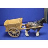 A CERAMIC HORSE AND WOODEN CART