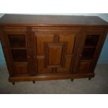 AN OAK MODIFIED SIDEBOARD CUPBOARD