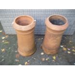 A PAIR OF TERRACOTTA CHIMNEY POT PLANTERS