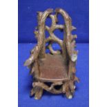 AN ANTIQUE MINIATURE RUSTIC SALT GLAZED CHAIR DATED 1899 A/F