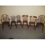SIX SOLID WOODEN DINING CHAIRS INCLUDING 2 WHEELBACK CARVERS