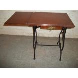 AN ANTIQUE CAST IRON SINGLE DROP LEAF SIDE TABLE