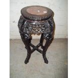 AN EBONISED MARBLE TOPPED PLANTER