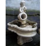 A RECONSTITUTED STONE WATER FOUNTAIN