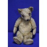 A VINTAGE JOINTED BEAR (WELL LOVED)