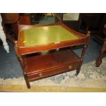 A REPRODUCTION MAHOGANY LEATHER TOP TABLE WITH FOLD-OVER GAMES TOP TABLE