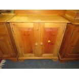 A SMALL MODERN PINE TWO DOOR CABINET W-70 CM