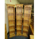 A SET OF THREE MODERN OPEN PINE BOOKCASES H-182 W-36 CM WITH ANOTHER SLIGHTLY WIDER PINS BOOKCASE (