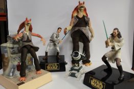 A COLLECTION OF FOUR MODERN STAR WARS FIGURES
