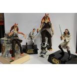A COLLECTION OF FOUR MODERN STAR WARS FIGURES