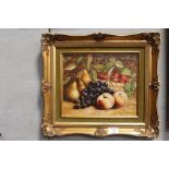 A GILT FRAMED A WILSON OIL ON BOARD STILL LIFE WITH THREE PEARS