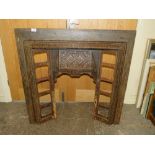 A VINTAGE CAST IRON FIRE SURROUND