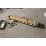 A SURVEYORS TRIPOD AND CASED LEVEL