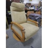 A MODERN UPHOLSTERED RECLINING ARMCHAIR