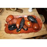 A CARVED WOODEN TRAY TOGETHER WITH A SELECTION OF CARVED WOODEN FRUIT