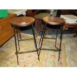 A PAIR OF METAL MODERN BAR STOOLS WITH COPPER TOPS