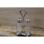 A STERLING SILVER AND GLASS CRUET BY R W & S